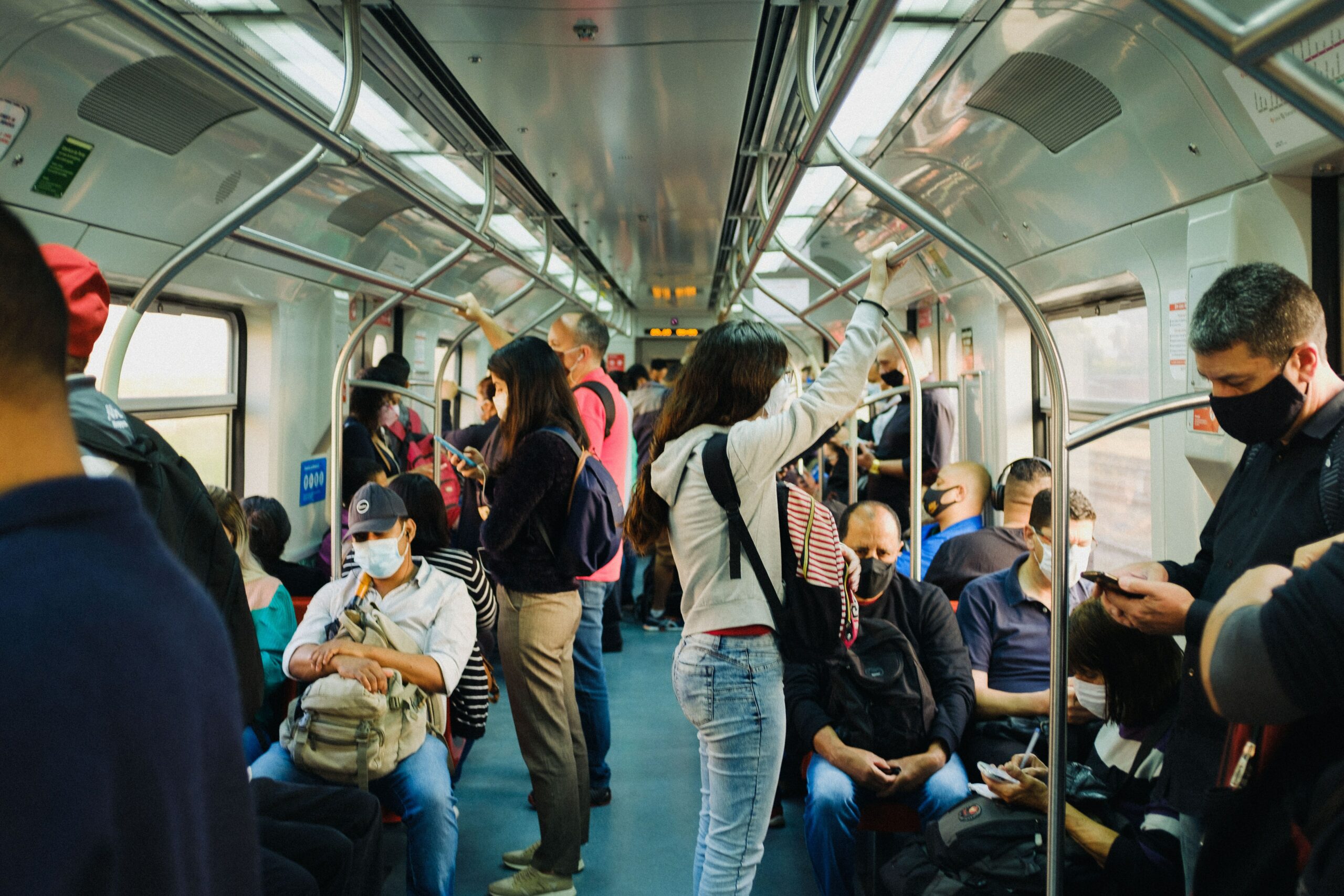 Public transport in Sao Paulo a woman holds on in a tube