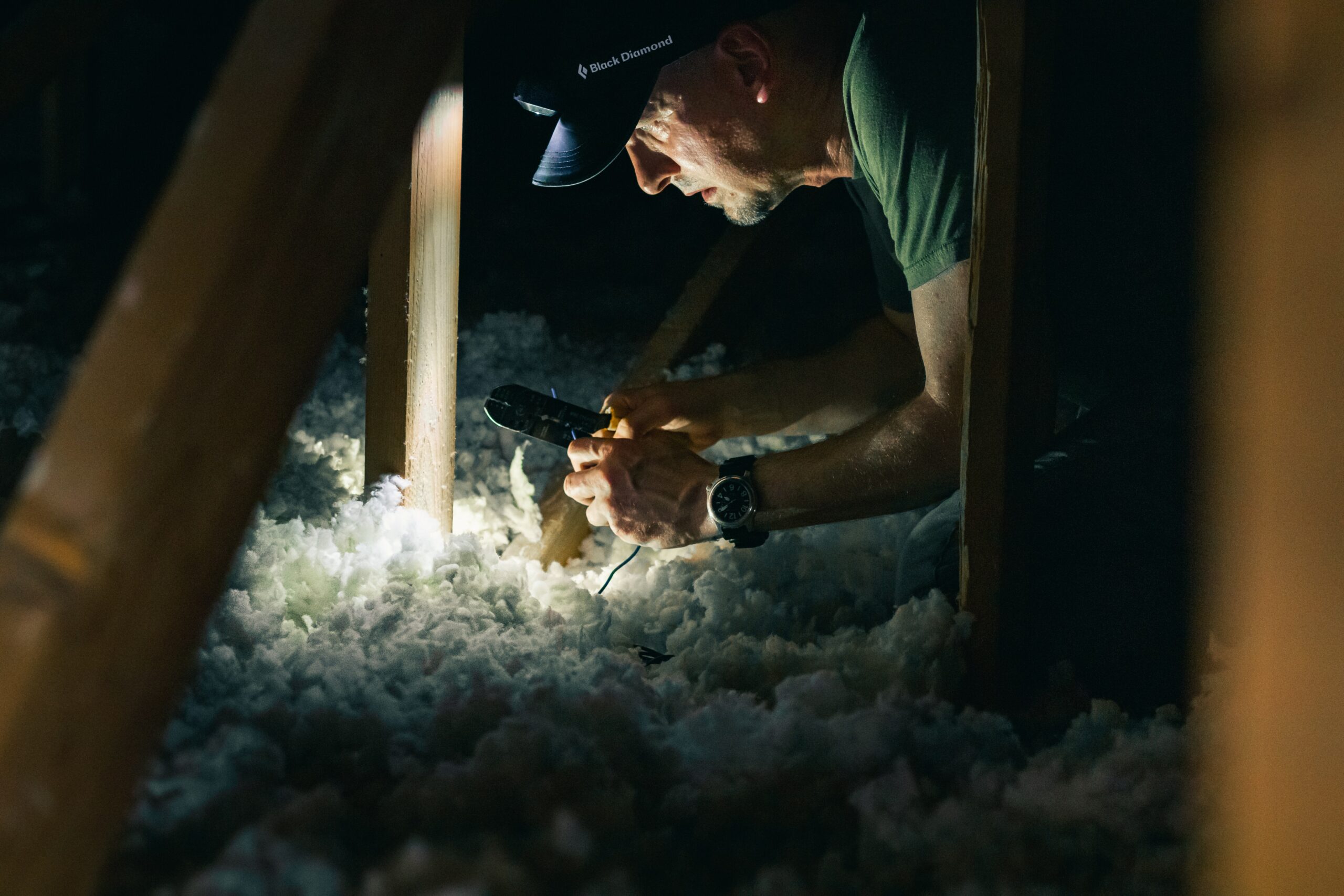 A man insulating his loft